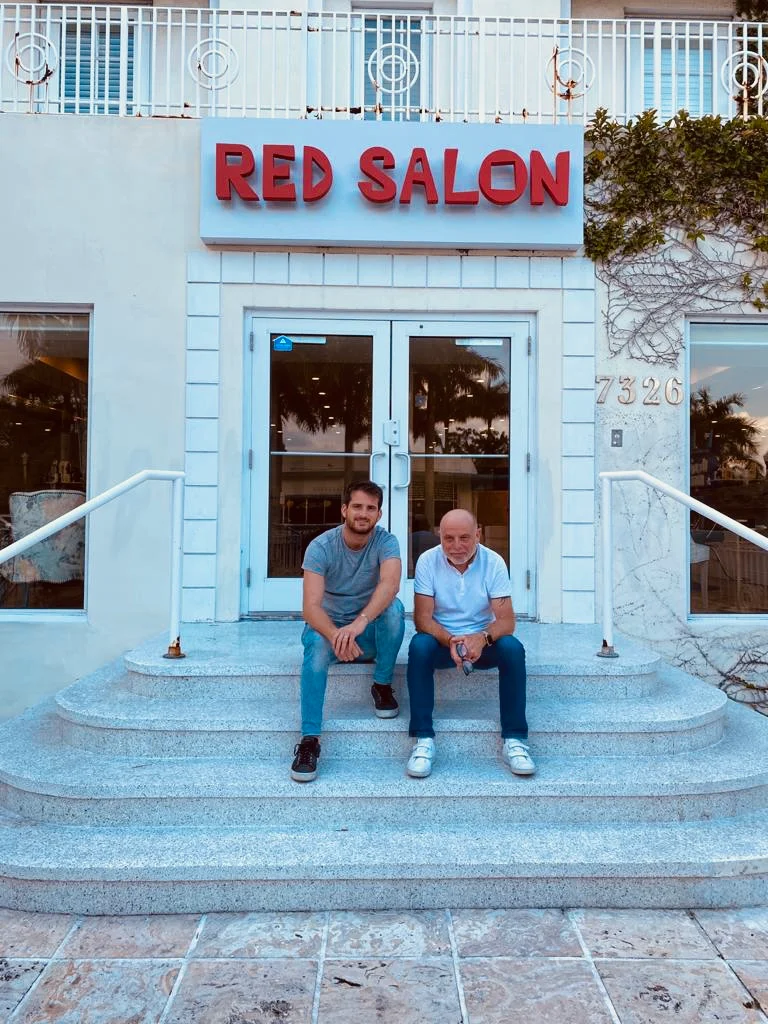 Michel and his son on the steps of Red Salon, 7326 Biscayne Blvd, Miami